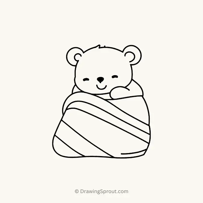 Sleeping bear in cozy blanket